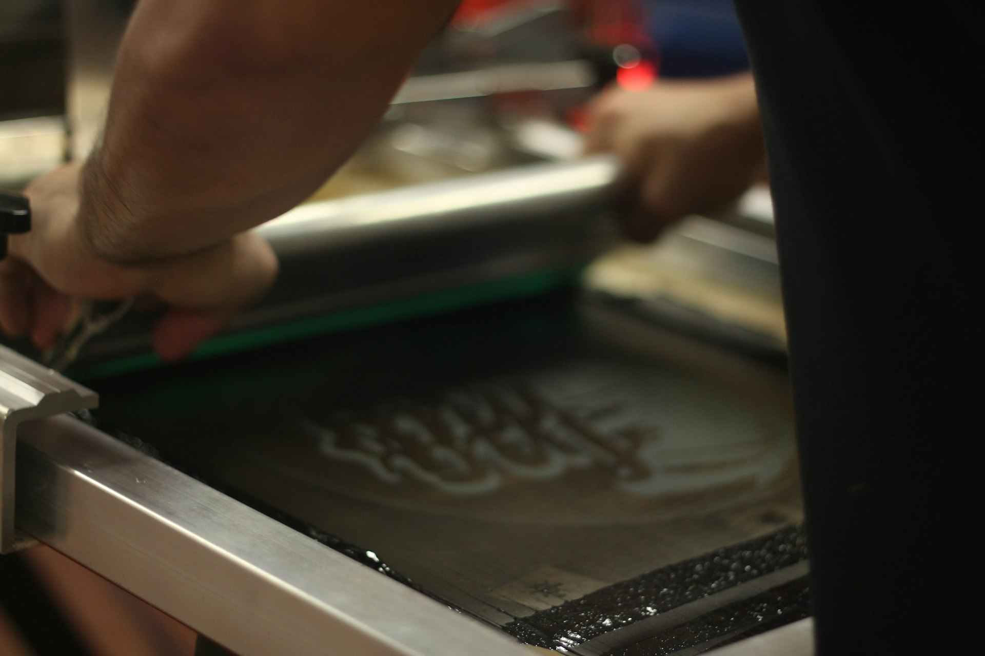 a person cutting something with a knife on a cutting board