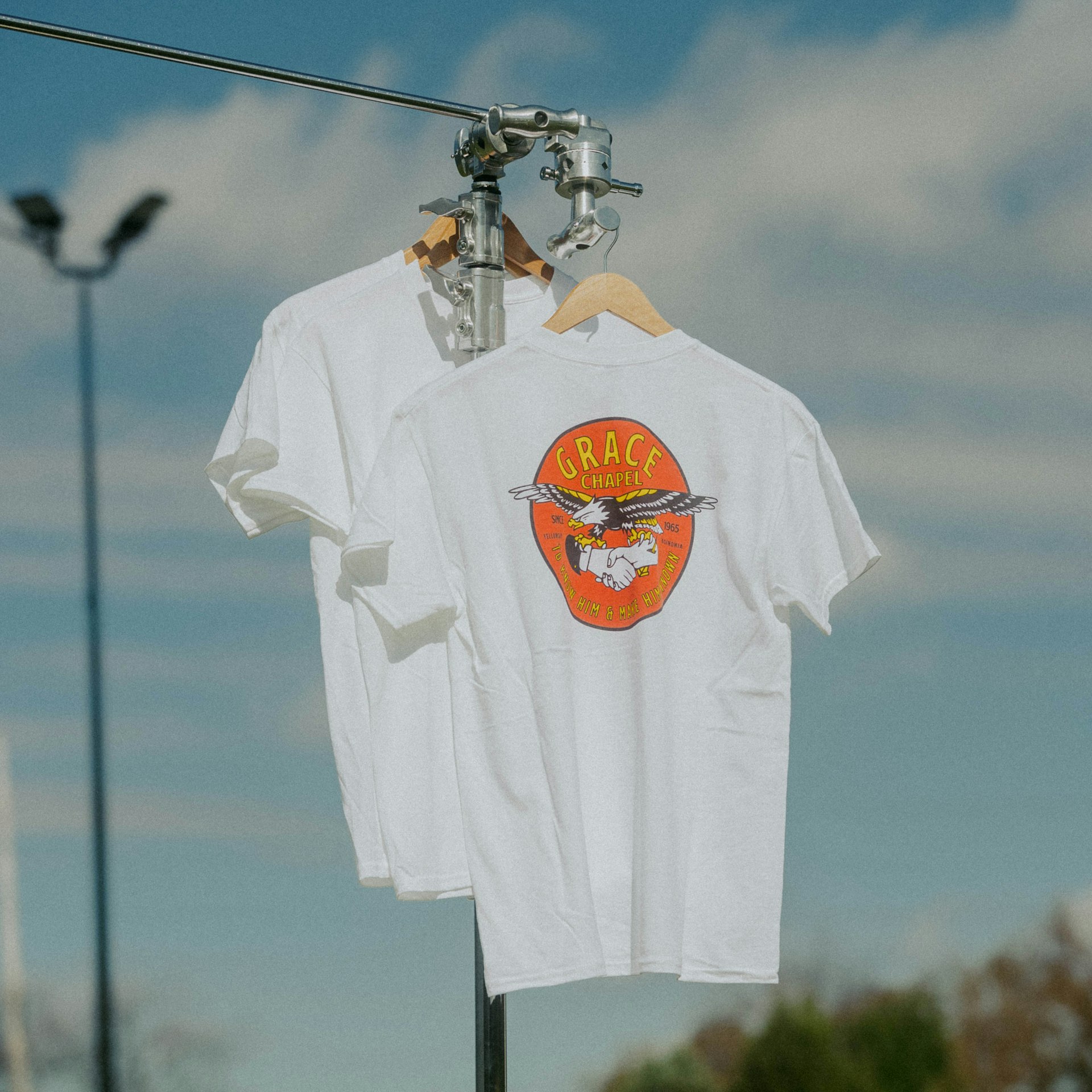 a white shirt hanging on a clothes line